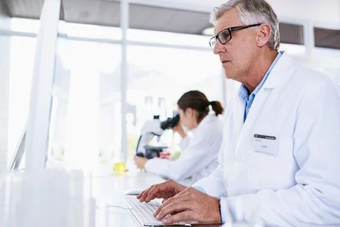Scientist, man and computer in science research, experiment or data results at Stock Photos