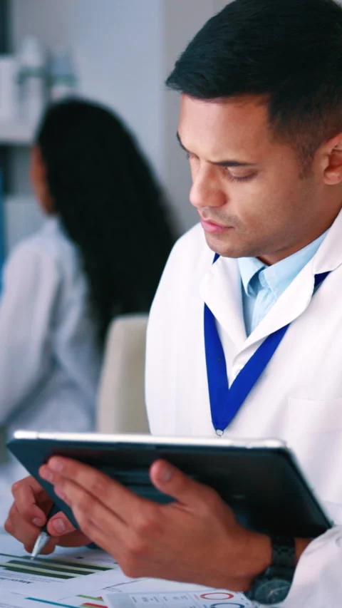 Scientist, man and data analysis in lab with tablet, medical research and Stock Footage 333379468
