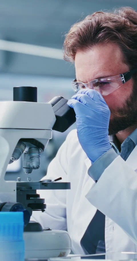 Scientist, man and PPE in lab with microscope, experiment and sample inspection Stock Footage 331524607
