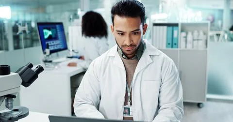 Scientist, man and reading computer for laboratory test, typing report or Stock Photos