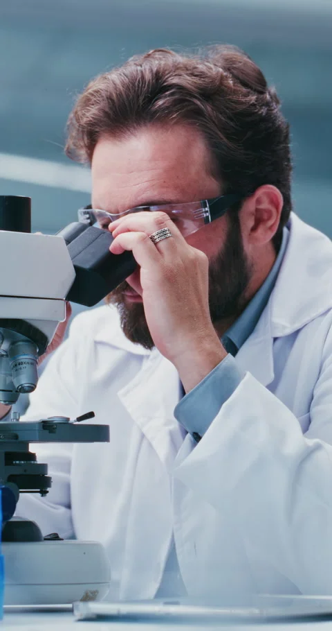 Scientist, man and research in lab with microscope, experiment or test sample Stock Footage 331519559