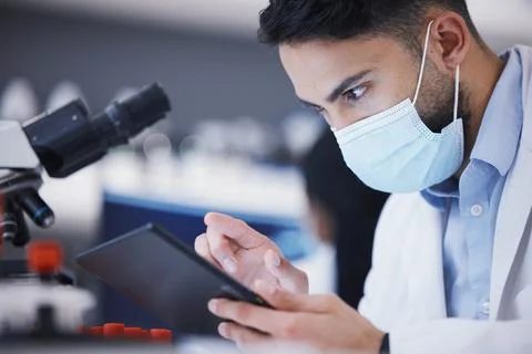 Scientist man, tablet and microscope analysis for dna, pharmaceutical company Foto stock