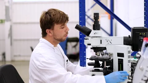 Scientist man using microscope in laboratory Stock-Footage 255196138