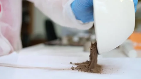 A scientist manually grinds a soil sample for experiments. Pour the soil Stock Footage 231739700
