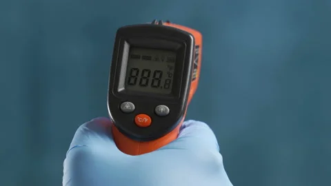 The scientist measures the temperature using a remote infrared pyrometer Stock Footage 103246749