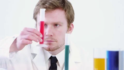 Scientist measuring liquids Video stock 80131684