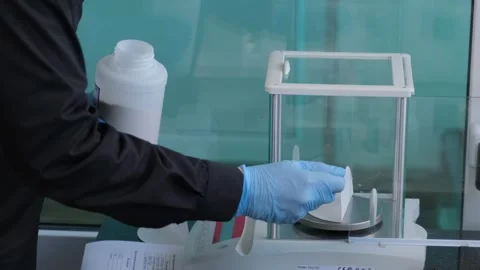 Scientist Measuring Powder on Laboratory Scale Stock Footage 302888812