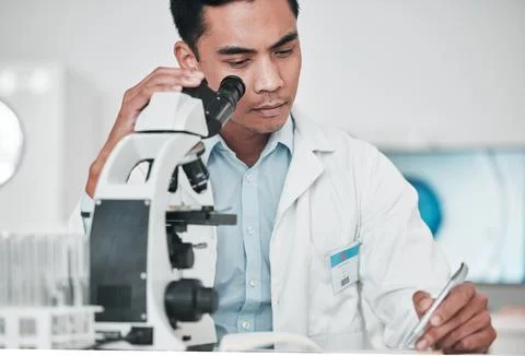 Scientist, microscope and man writing report, test results and research data for Stock Photos