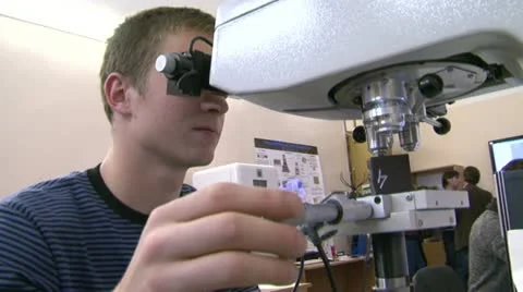 A scientist at the microscope Stock Footage 10830748