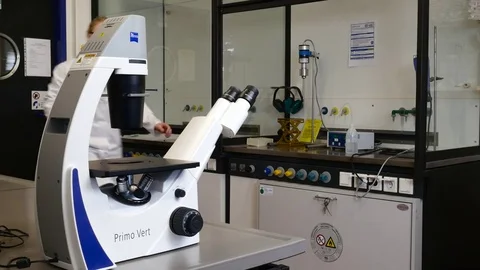 Scientist at the microscope Stock Footage 79853073