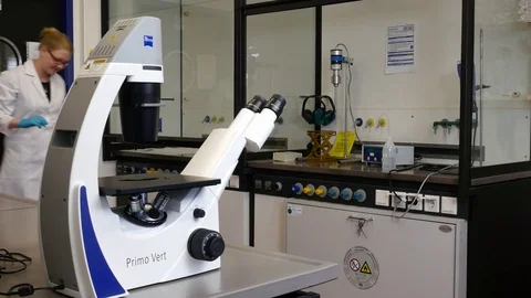 Scientist at the microscope Stock Footage 79853707
