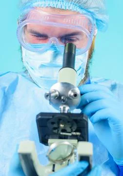 Scientist with microscope making test or research. Doctor using microscope in Stock-Fotos
