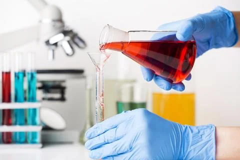 Scientist mixing chemical elements Stock Photos
