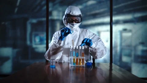 Scientist in the modern labortory working with test tubes, making experiments Stock Footage 95342012