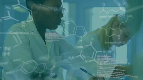 Scientist noting data reaching for flask inspecting green solution molecular Stock Footage 332936628