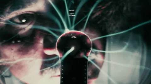 Scientist Observing High Voltage Lightning Discharges Inside Plasma Ball Stock Footage 337770463