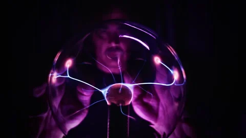 Scientist Observing High Voltage Lightning Discharges Inside Plasma Ball Stock Footage 337773153