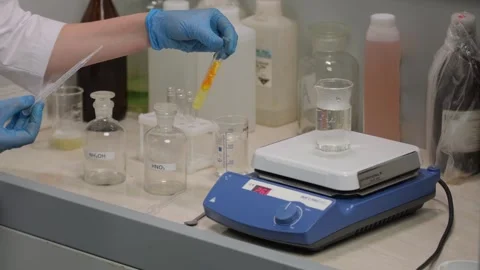 Scientist Observing Reaction in Flask Stock Footage 303370175