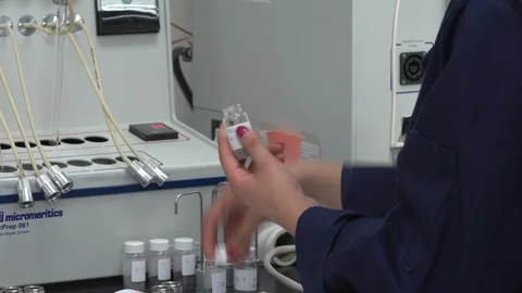 Scientist opening a bottle Stock Footage 106900730