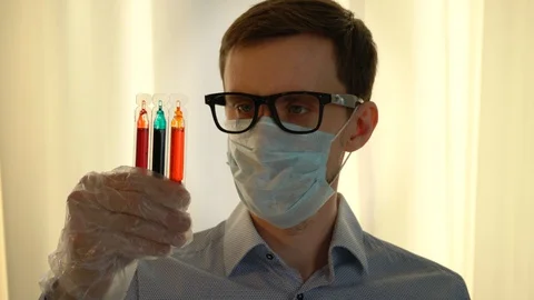 Scientist or Doctor with Samples in Test Tubes 스톡 동영상 128321359