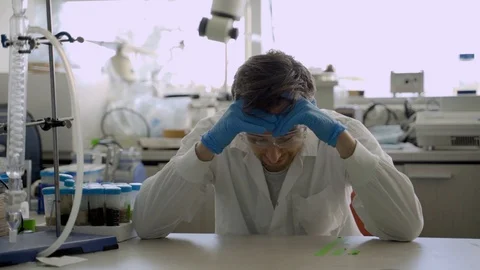 Scientist or lab assistant unhappy with results of an experiment or test Stock Footage 112597929