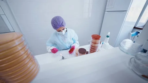 Scientist or worker in a bacteriological laboratory makes tests and analyzes Stock-Footage 189309890