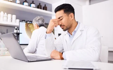 Scientist, pain and headache for computer research, pharmaceutical fail or data Stock Photos
