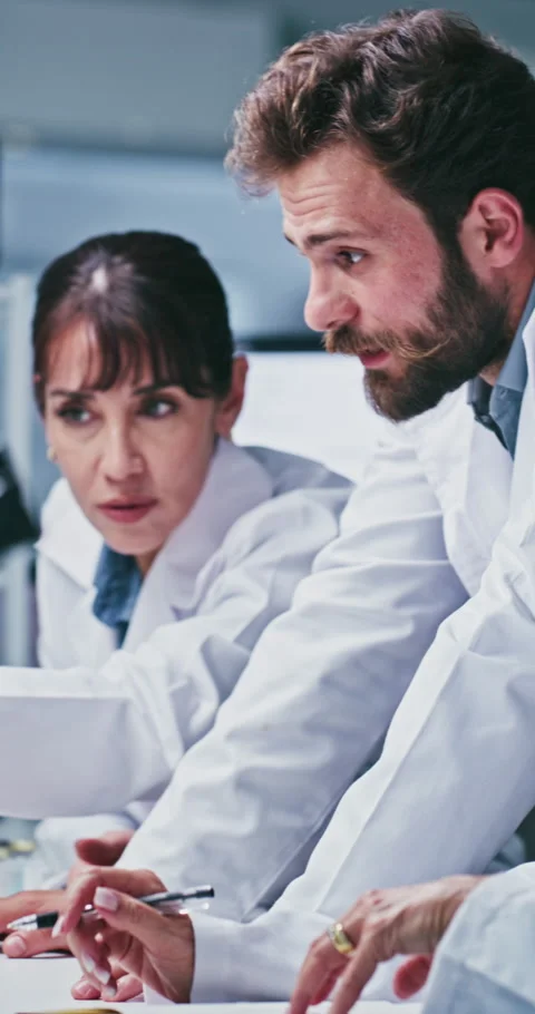 Scientist, people or computer with discussion in lab for clinical trial, medical Stock Footage 331516623