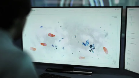 Scientist Performing Microscopic Study On Paramecium Via Digital Software Stock Footage 190900138