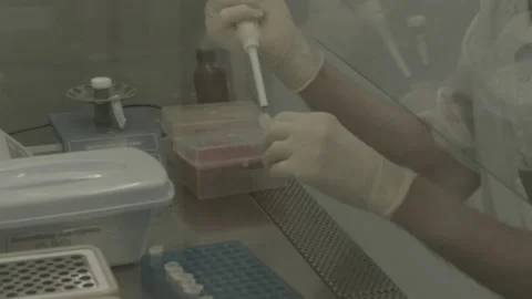Scientist performs a blood test for covid Stock Footage