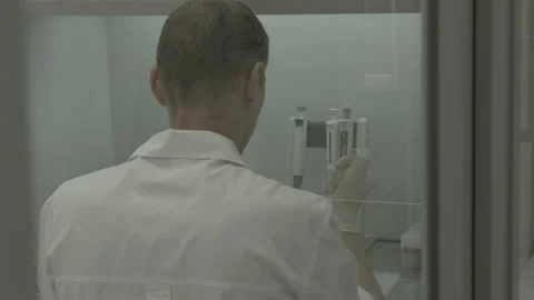 Scientist performs a blood test for covid Video stock 143161572