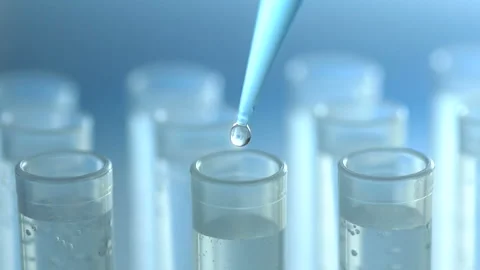 A scientist with a pipette analyzes a colored liquid to extract the DNA and Stock Footage 87745721