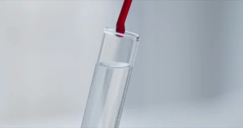 Scientist with pipette analyzes red colored liquid to extract the DNA Video stock 126163840