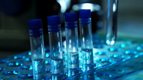 Scientist Placing Test Tubes In Laboratory Ready For Vaccine Testing Stock Footage 136894271