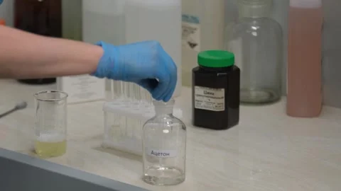Scientist Placing Test Tubes in Laboratory Rack Stock Footage 302888542