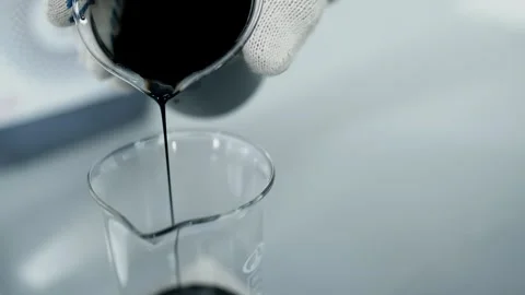 Scientist Pouring Crude Oil Sample in Laboratory Closeup 動画素材 335188534