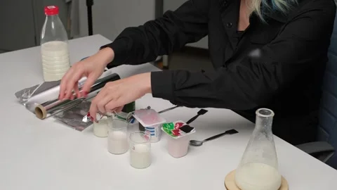 Scientist Pouring Milk for Laboratory Analysis Stock Footage 306322813