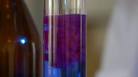 Scientist Pours Blue Pattern Chemicals Into In Flask. health care and medical Stock Footage 77772709
