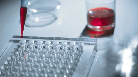 The scientist pours the reagents on test tubes. Concept - biochemical analyzes Stock Footage 96415416
