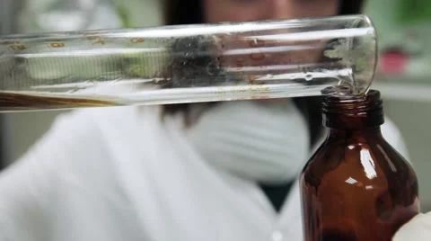 Scientist pours a solution. Clip about medicine, chemistry and science. Stock Footage 46965581