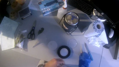 Scientist POV shot conducting experiments in the lab v5 Stock Footage 117863330