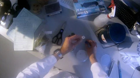 Scientist POV shot conducting experiments in the lab v3 Stock Footage 117863390