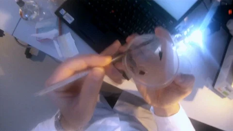 Scientist POV shot conducting experiments in the lab v8 Stock Footage 117863472