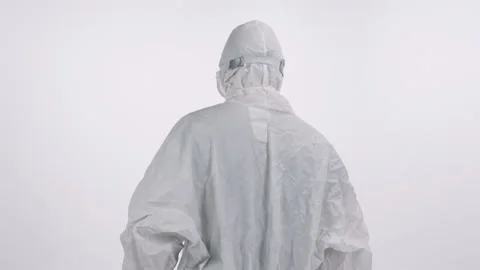 A scientist in PPE entering and verifying a medical record on a white background Stock Footage 297966468