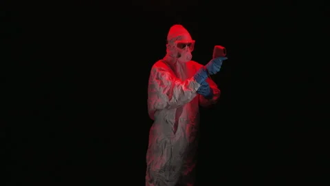 Scientist in PPE holding thermal camera Video stock 299922065