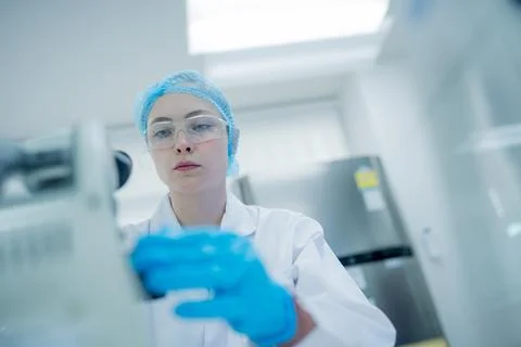 Scientist prepares samples in a modern laboratory setting during a research.. Stock Photos
