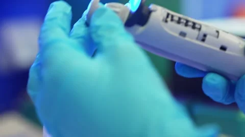 Scientist Preparing an Electrical Pipette Stock Footage 160257662
