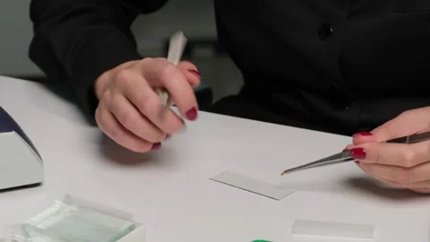 Scientist Preparing Microscope Slide for Laboratory Testing Stock Footage 306323260