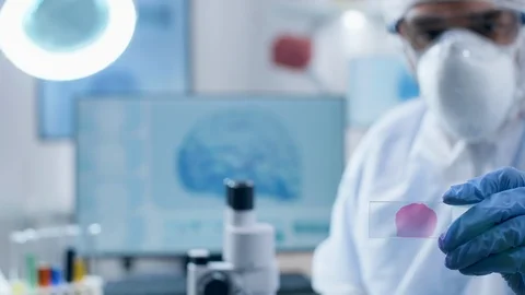 Scientist presenting a sample then analyzing it Stock Footage 108739668