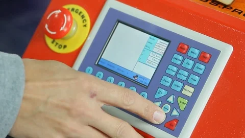 The scientist presses the buttons to prepare the laser engraving machine Stock Footage 84785723